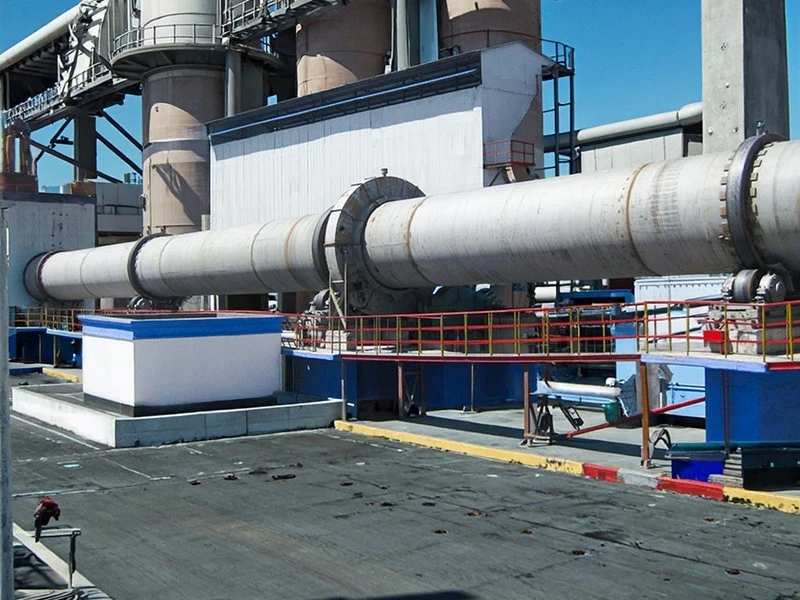AGICO Rotary Cement Kiln - Equipment Overview Rotary cement kiln shell and support assemblies on an industrial process line