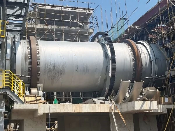 Rotary kiln shell, girth gear and support structure at an industrial plant