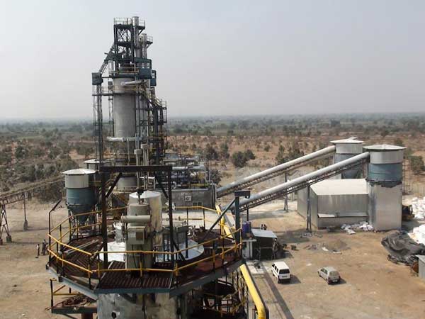 Cement plant kiln tower with conveyors and material handling equipment